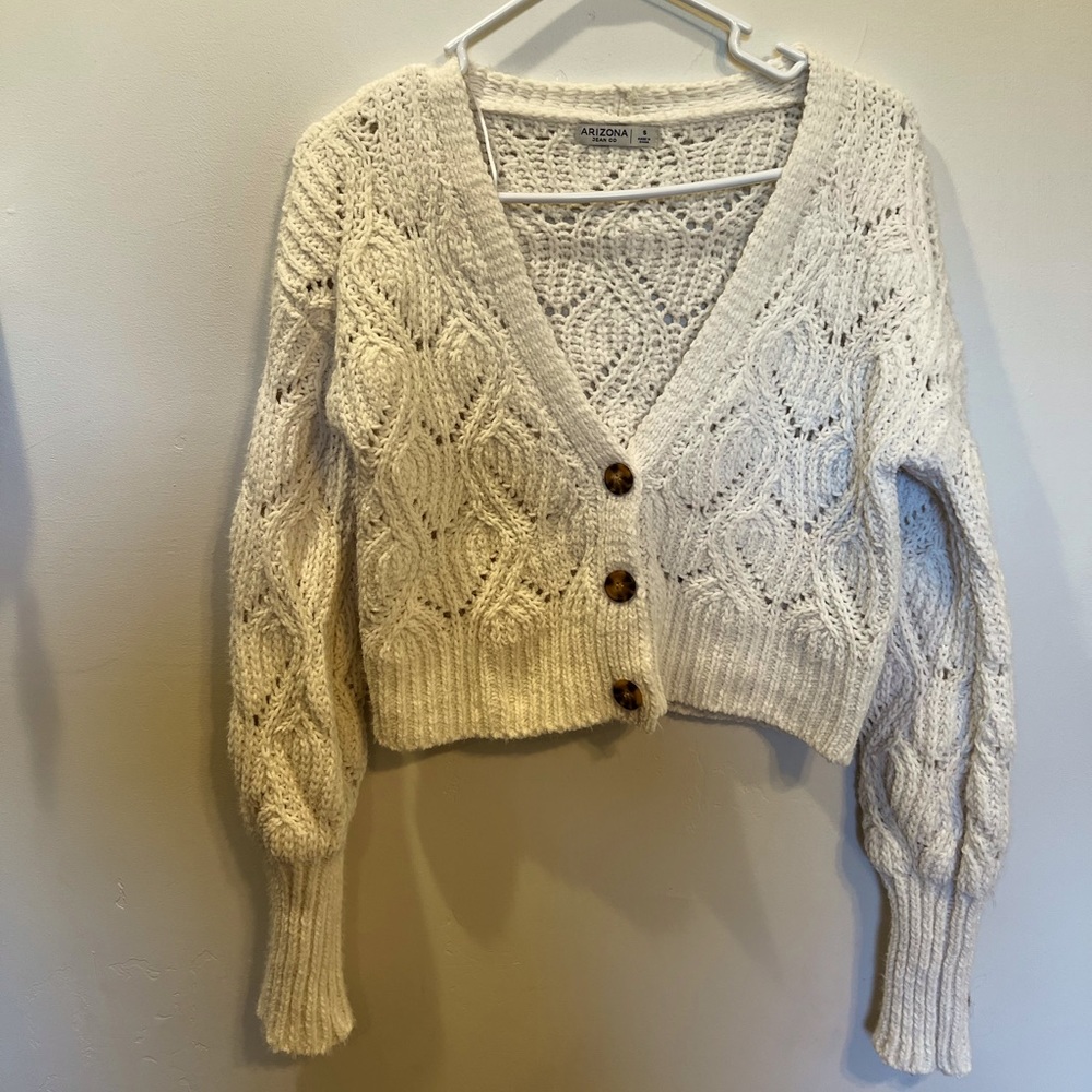 Cute knit sweater. Buttons up.
